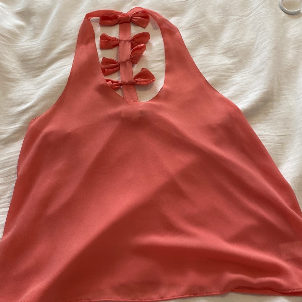 Sheet pink tank top with bows down back